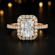 Front view of a radiant cut halo lab-grown diamond engagement ring in 18kt yellow gold.