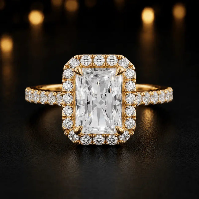 Front view of a radiant cut halo lab-grown diamond engagement ring in 18kt yellow gold.