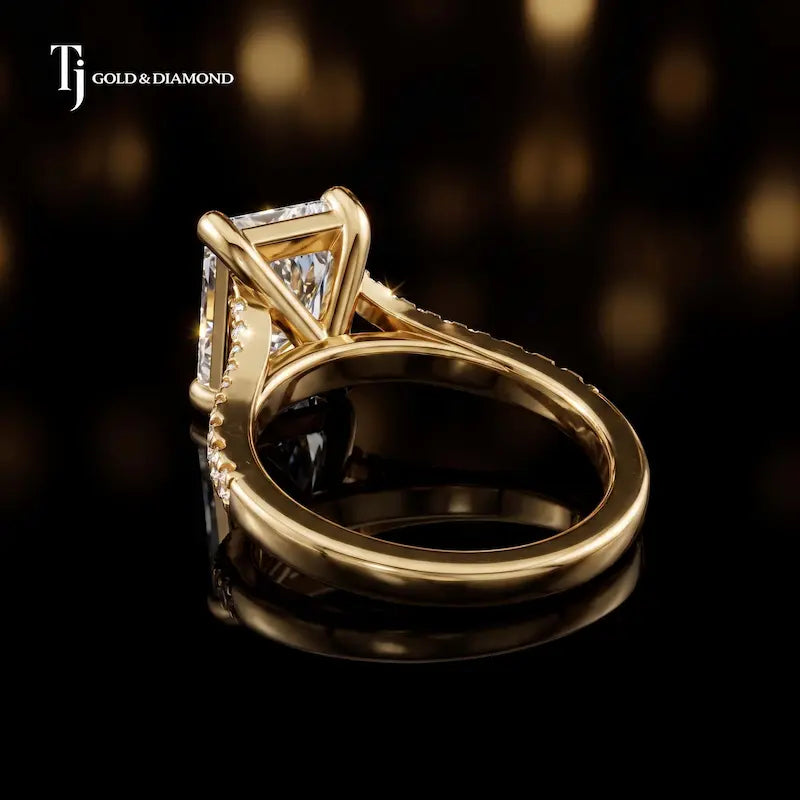 Back view of a radiant cut split shank lab-grown diamond engagement ring in 18kt yellow gold.