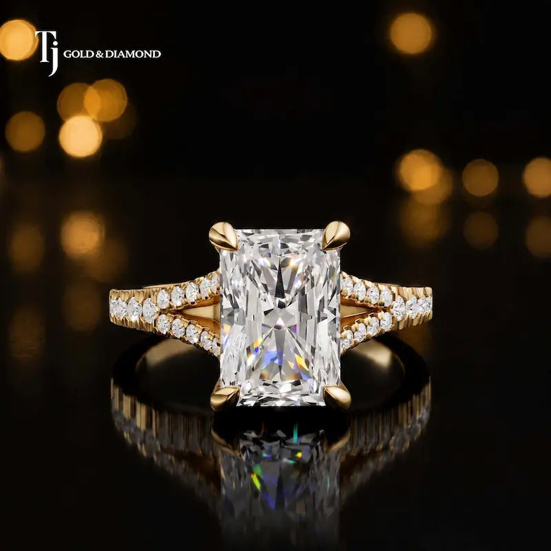 Front view of a radiant cut split shank lab-grown diamond engagement ring in 18kt yellow gold.