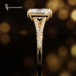 Side profile of a radiant cut split shank lab-grown diamond engagement ring with diamond-set shoulders in 18kt yellow gold.