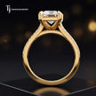 Side view of a radiant cut split shank lab-grown diamond engagement ring featuring a four-claw cathedral setting in 18kt yellow gold.