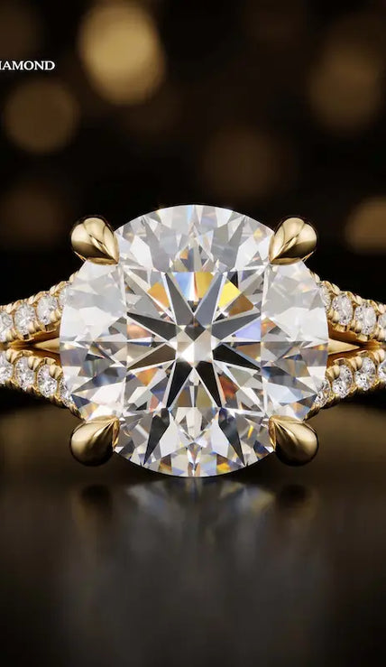 Front view of a round cut split shank lab-grown diamond engagement ring in 18kt yellow gold.