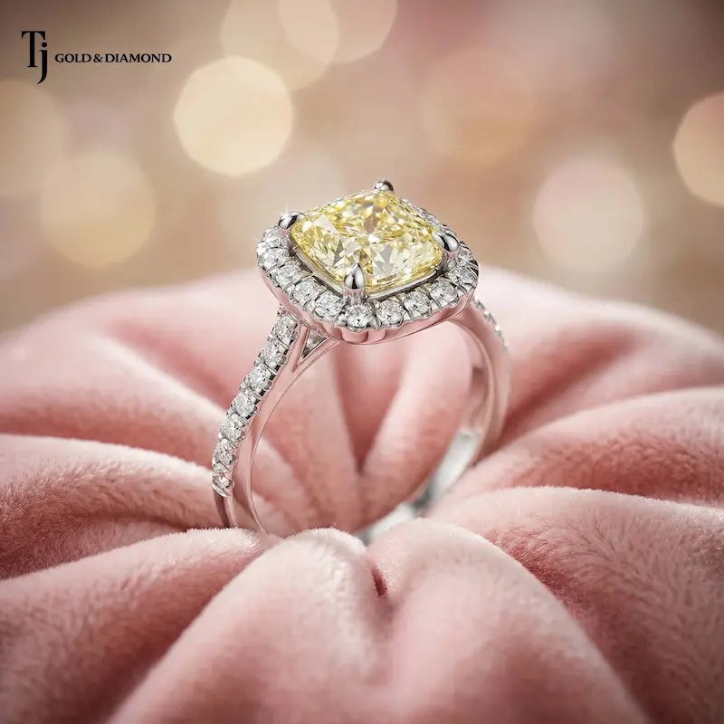 Angled side profile of a Cushion Cut Fancy Yellow Lab-Grown Diamond Halo Ring in polished 18kt white gold showcasing the elevated halo setting and pavé diamond band.
