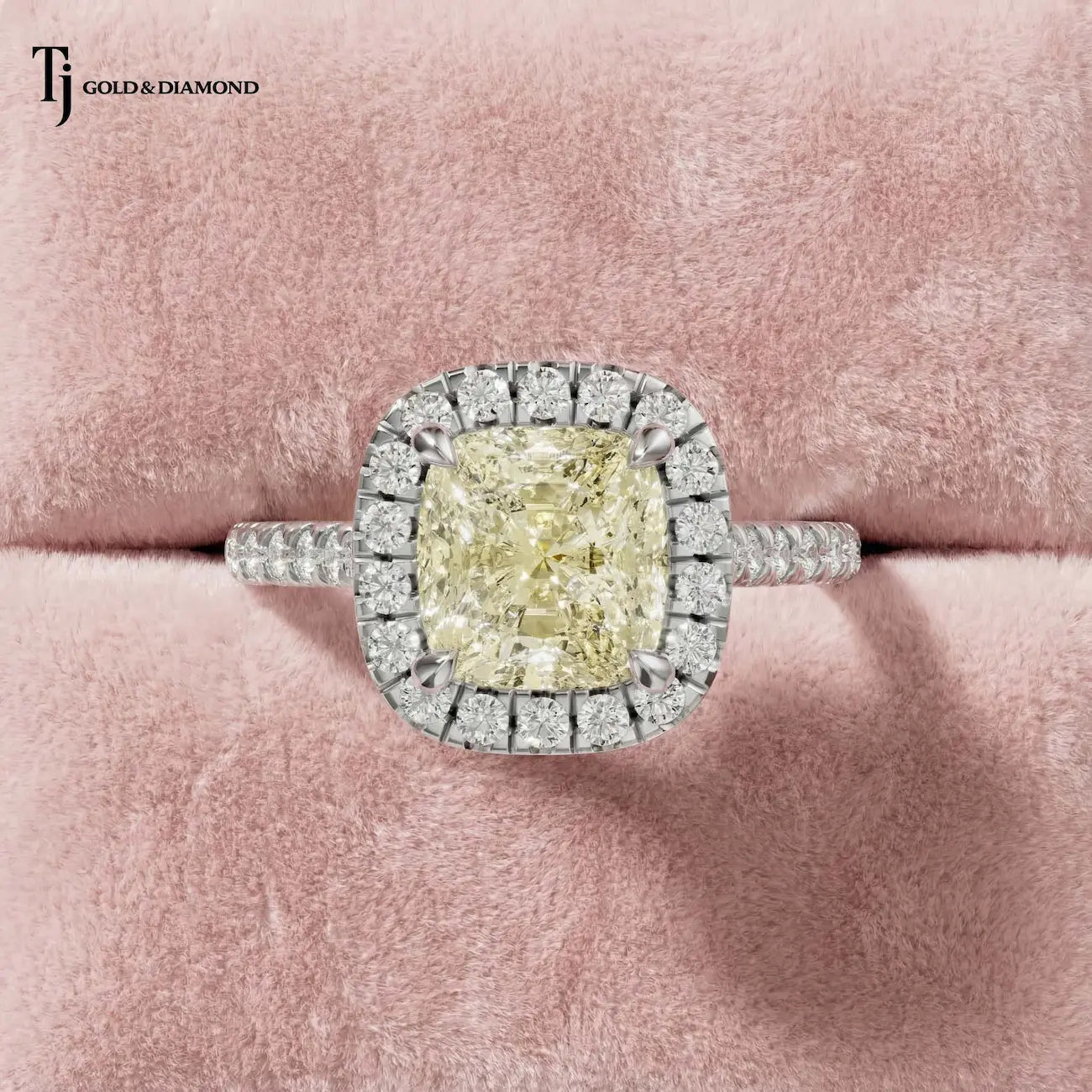 Cushion Cut Fancy Yellow Lab-Grown Diamond Halo Ring in 18kt white gold featuring a cushion cut fancy yellow centre diamond surrounded by a round brilliant diamond halo.