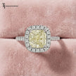 Cushion Cut Fancy Yellow Lab-Grown Diamond Halo Ring in 18kt white gold featuring a cushion cut fancy yellow centre diamond surrounded by a round brilliant diamond halo.