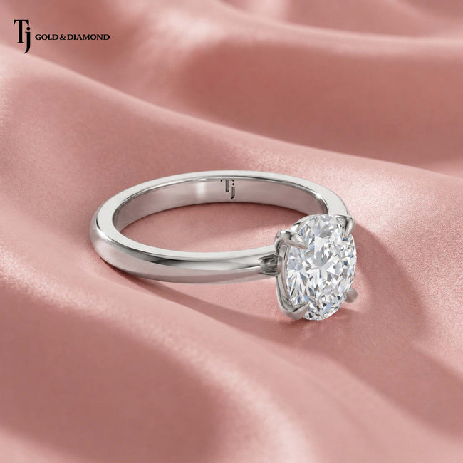 Oval solitaire diamond engagement ring in white gold