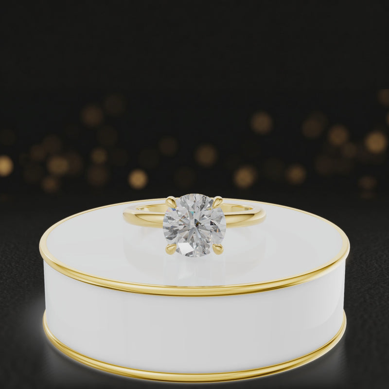 360-degree spinning video of a round cut lab-grown diamond engagement ring with hidden halo in 18kt yellow gold