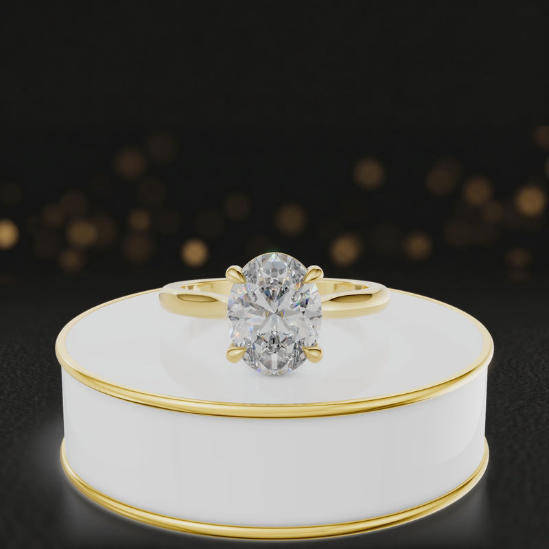 360-degree rotating view of a 1.5 carat oval cut diamond solitaire engagement ring in an 18kt yellow gold 4 claw setting by TJ Diamond