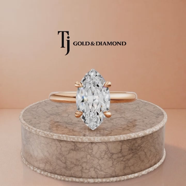360-degree rotating view of a 1.5 carat marquise cut lab-grown diamond solitaire engagement ring in 18kt rose gold with a 4-claw setting