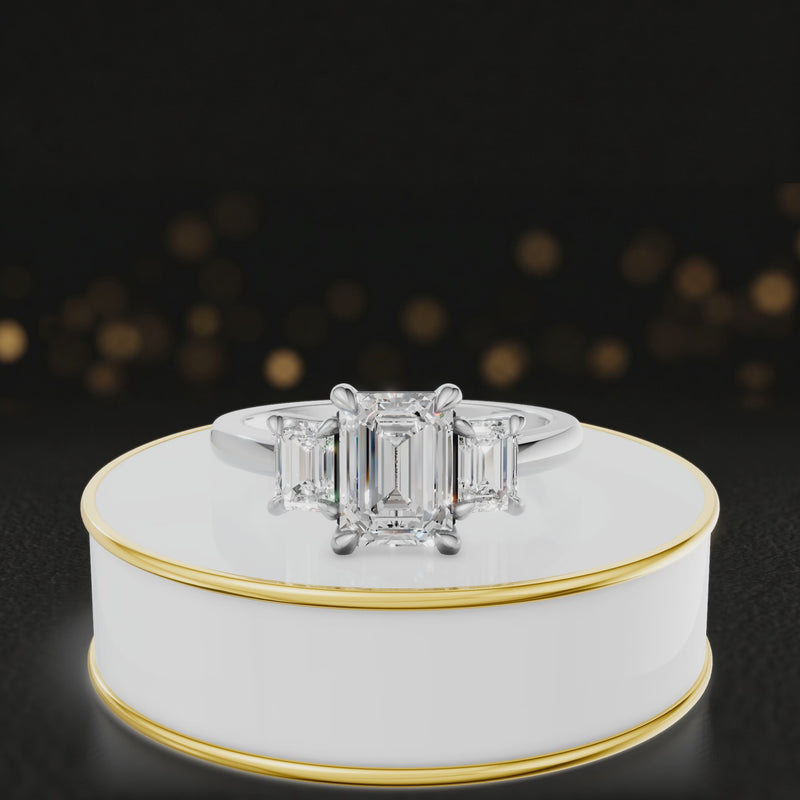 360° rotating view of an emerald-cut lab-grown diamond trilogy engagement ring in 18ct white gold, featuring three emerald-cut lab-grown diamonds.
