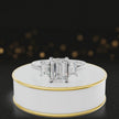 360° rotating view of an emerald-cut lab-grown diamond trilogy engagement ring in 18ct white gold, featuring three emerald-cut lab-grown diamonds.
