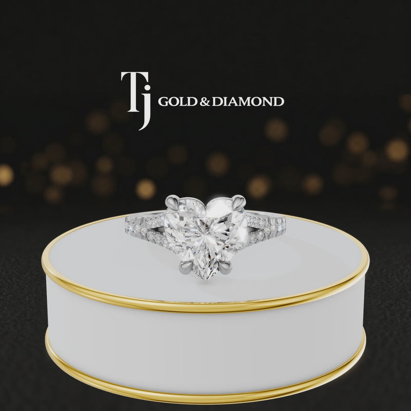 360° product view of a heart cut split shank lab-grown diamond engagement ring in 18kt white gold featuring a heart-cut centre diamond, classic four-claw cathedral setting and diamond-set split shank.