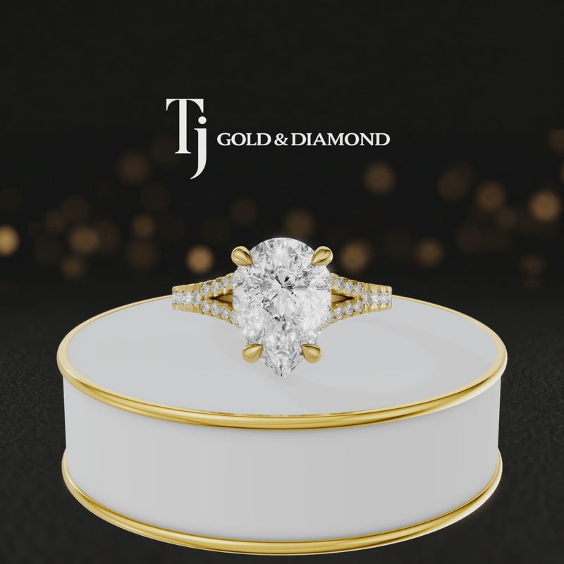 360° product view of a pear cut split shank lab-grown diamond engagement ring in 18kt yellow gold featuring a pear-cut centre diamond, classic four-claw cathedral setting and diamond-set split shank.