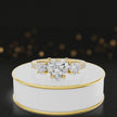 360-degree spinning view of a heart cut three-stone lab-grown diamond engagement ring in 18kt yellow gold with diamond shoulders