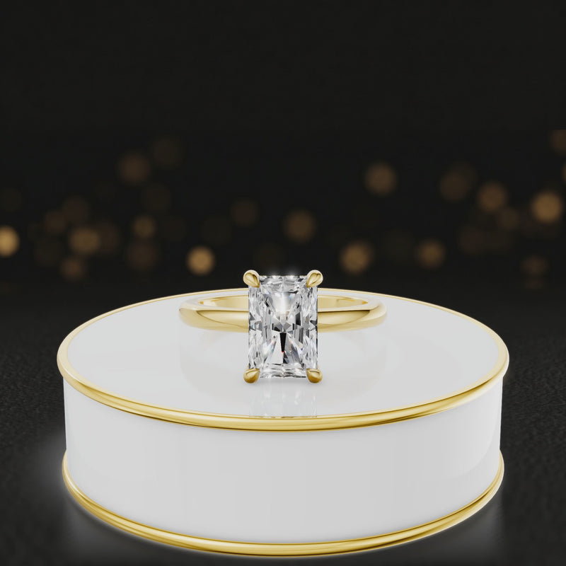 360-degree spinning video of a radiant cut lab-grown diamond engagement ring with hidden halo in 18kt yellow gold