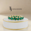 360° product view of a created emerald full eternity ring in 18kt yellow gold with round brilliant lab-created emeralds.