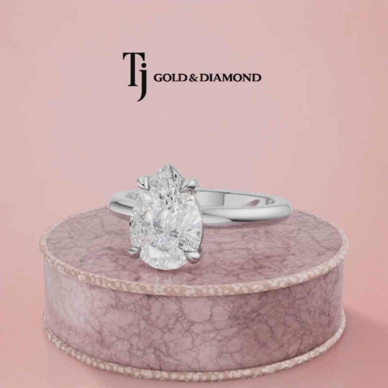 360-degree rotating view of a 1.5 carat pear cut lab-grown diamond solitaire engagement ring in 18kt white gold with a 4-claw setting