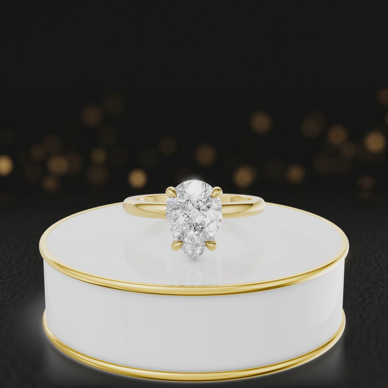 360 degree spinning video of 4-claw pear cut engagement ring with hidden halo in 18kt yellow gold