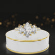 360-degree spinning view of a marquise cut three-stone lab-grown diamond engagement ring in 18kt yellow gold with diamond shoulders