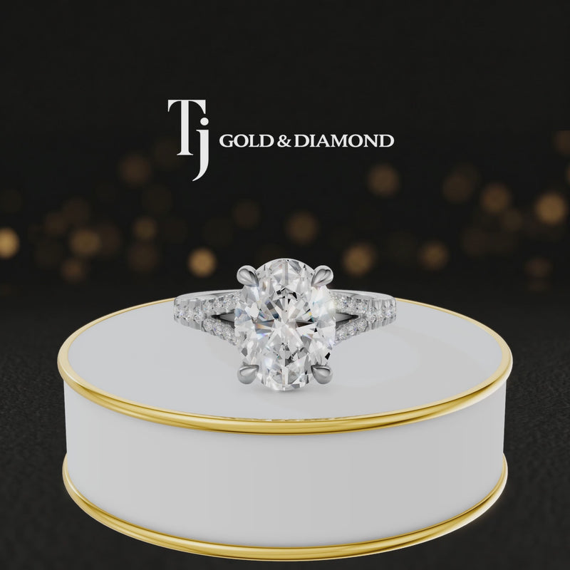 360° product view of an oval cut split shank lab-grown diamond engagement ring in 18kt white gold featuring an oval-cut centre diamond, classic four-claw cathedral setting and diamond-set split shank.