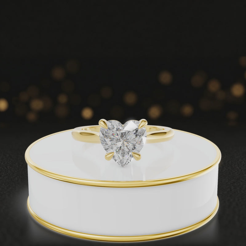 360-degree rotating view of a 1.5 carat heart cut diamond solitaire engagement ring in an 18kt yellow gold 4 claw setting by TJ Diamond