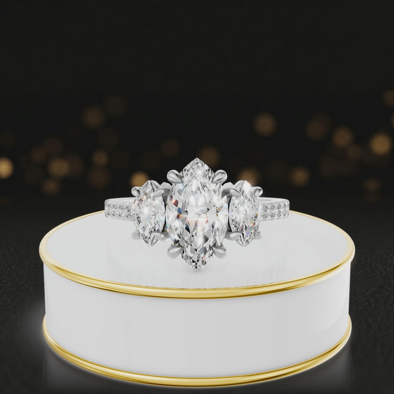 360-degree spinning view of a marquise cut three-stone lab-grown diamond engagement ring in 18kt white gold with diamond shoulders