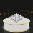 360-degree spinning view of a marquise cut three-stone lab-grown diamond engagement ring in 18kt white gold with diamond shoulders