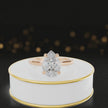 360-degree rotating view of a 1.5 carat pear cut diamond solitaire engagement ring in an 18kt rose gold 4 claw setting by TJ Diamond