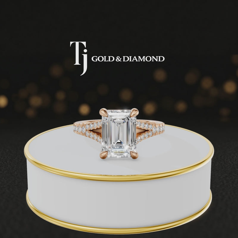 360° product view of an emerald cut split shank lab-grown diamond engagement ring in 18kt rose gold featuring an emerald-cut centre diamond, classic four-claw cathedral setting and diamond-set split shank.