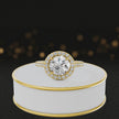 360° video of a Round Cut Halo Lab-Grown Diamond Engagement Ring in 18kt Yellow Gold featuring a round brilliant centre diamond, sparkling diamond halo and diamond-set shoulders.