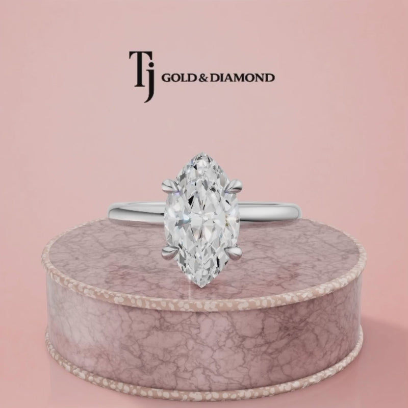 360-degree rotating view of a 1.5 carat marquise cut lab-grown diamond solitaire engagement ring in 18kt white gold with a 4-claw setting