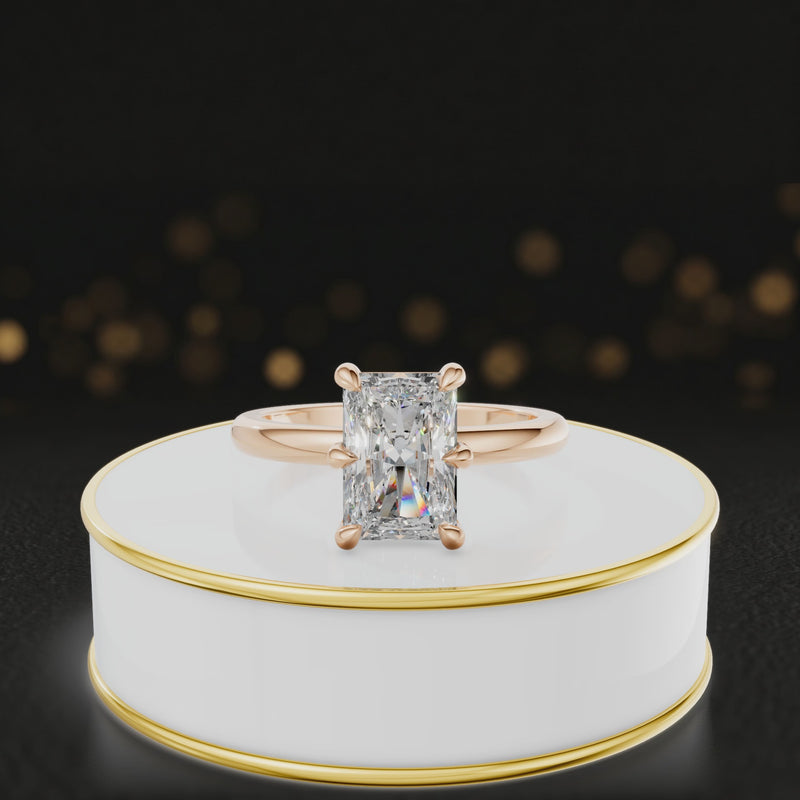 360-degree rotating view of a 1.5 carat radiant cut diamond solitaire engagement ring in an 18kt rose gold 6 claw setting by TJ Diamond