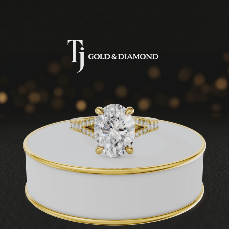 360° product view of an oval cut split shank lab-grown diamond engagement ring in 18kt yellow gold featuring an oval-cut centre diamond, classic four-claw cathedral setting and diamond-set split shank.