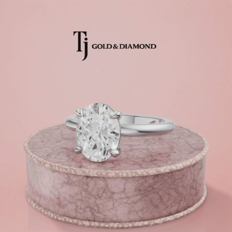 360-degree rotating view of a 1.5 carat oval cut lab-grown diamond solitaire engagement ring in 18kt white gold with a 4-claw setting