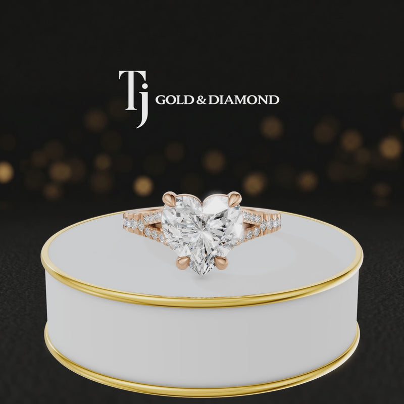 360° product view of a heart cut split shank lab-grown diamond engagement ring in 18kt rose gold featuring a heart-cut centre diamond, classic four-claw cathedral setting and diamond-set split shank.