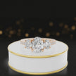 360-degree spinning view of an oval cut three-stone lab-grown diamond engagement ring in 18kt rose gold with diamond shoulders