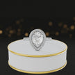 360° video of a Pear Cut Halo Lab-Grown Diamond Engagement Ring in 18kt White Gold featuring a pear-cut centre diamond, sparkling diamond halo and diamond-set shoulders.