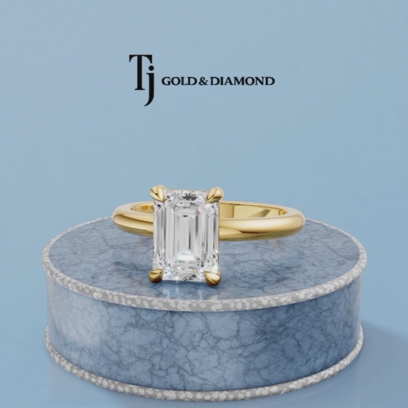 360-degree spinning view of a 1.5 carat emerald cut lab-grown diamond solitaire engagement ring in 18kt yellow gold with a 4-claw setting