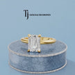 360-degree spinning view of a 1.5 carat emerald cut lab-grown diamond solitaire engagement ring in 18kt yellow gold with a 4-claw setting