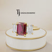 360° product view of an emerald cut lab-created ruby trilogy engagement ring in 18kt yellow gold with emerald cut lab-grown diamond side stones and a classic four claw basket setting.