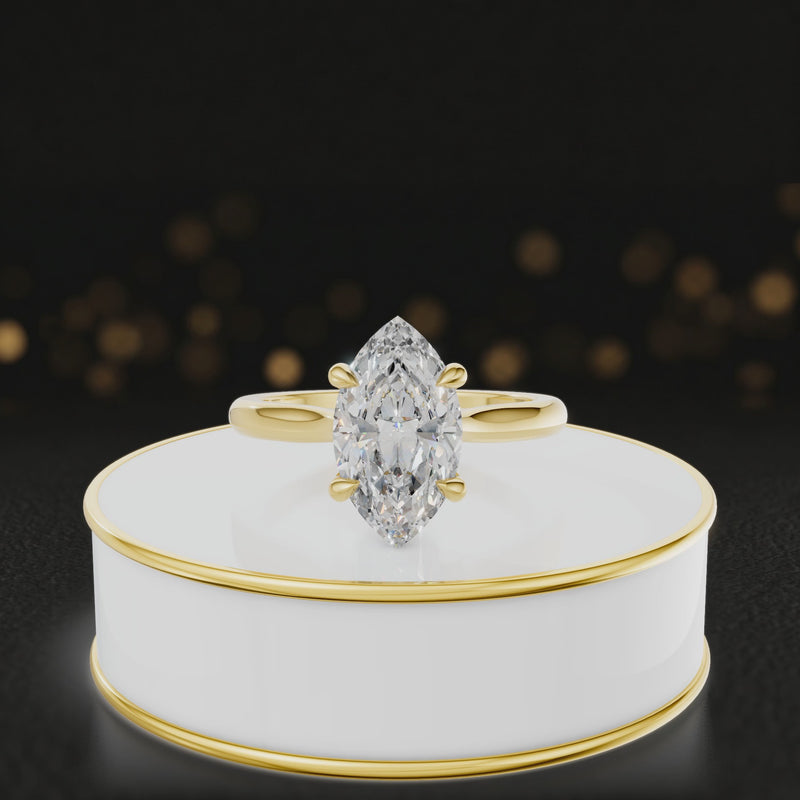 360-degree rotating view of a 1.5 carat marquise cut diamond solitaire engagement ring in an 18kt yellow gold 4 claw setting by TJ Diamond