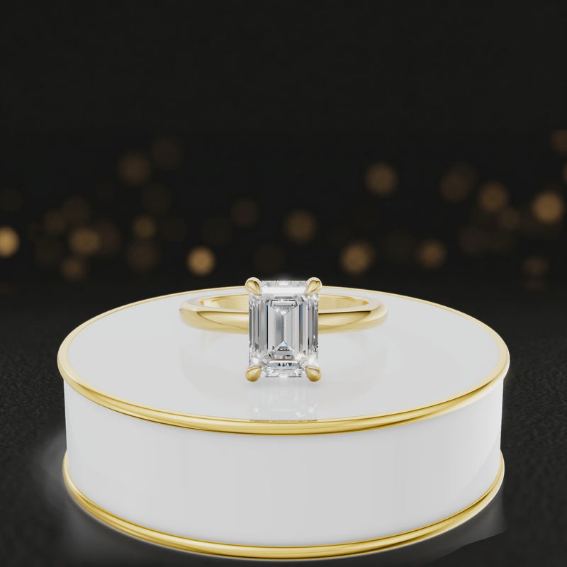 360 degree spinning video of 4-claw emerald cut engagement ring with hidden halo in 18kt yellow gold
