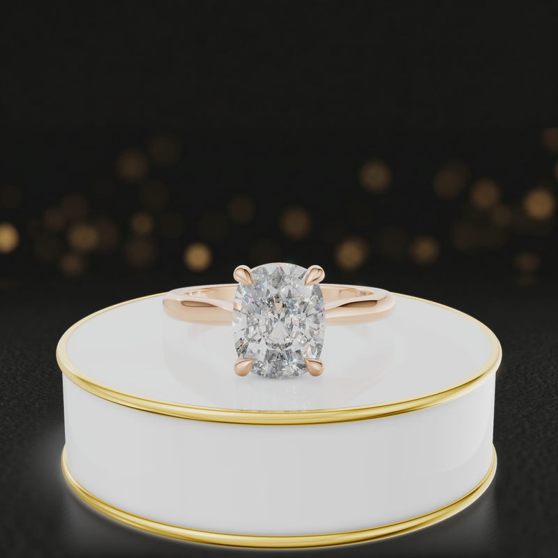 360-degree rotating view of a 1.5 carat cushion cut diamond solitaire engagement ring in an 18kt rose gold 4 claw setting by TJ Diamond