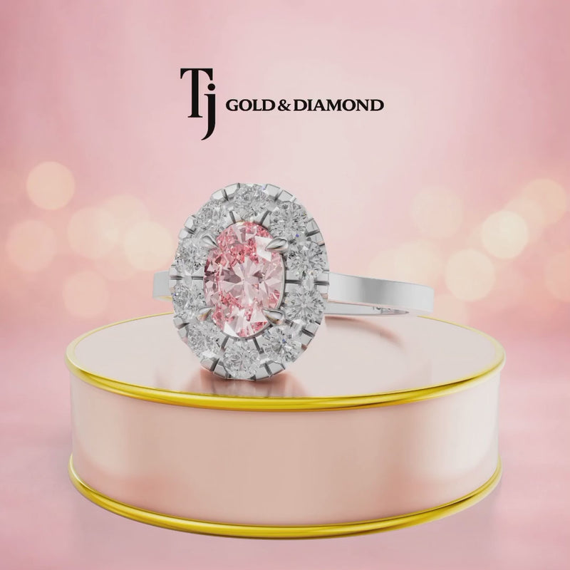 360° rotating view of an Oval Lab-Created Pink Diamond Halo Ring in 18kt white gold featuring an oval lab-created pink diamond surrounded by round brilliant lab-grown diamonds.