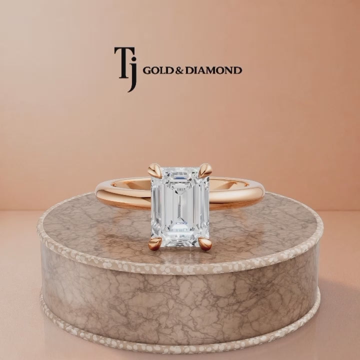 360-degree spinning view of a 1.5 carat emerald cut lab-grown diamond solitaire engagement ring in 18kt rose gold with a 4-claw setting