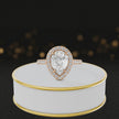 360° video of a Pear Cut Halo Lab-Grown Diamond Engagement Ring in 18kt Rose Gold featuring a pear-cut centre diamond, sparkling diamond halo and diamond-set shoulders.
