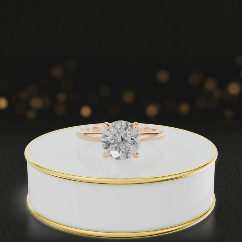 360-degree spinning video of a round cut lab-grown diamond engagement ring with hidden halo in 18kt rose gold