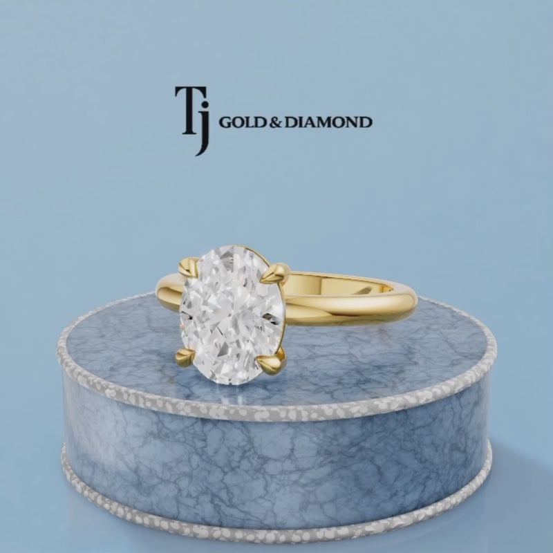 360-degree rotating view of a 1.5 carat oval cut lab-grown diamond solitaire engagement ring in 18kt yellow gold with a 4-claw setting