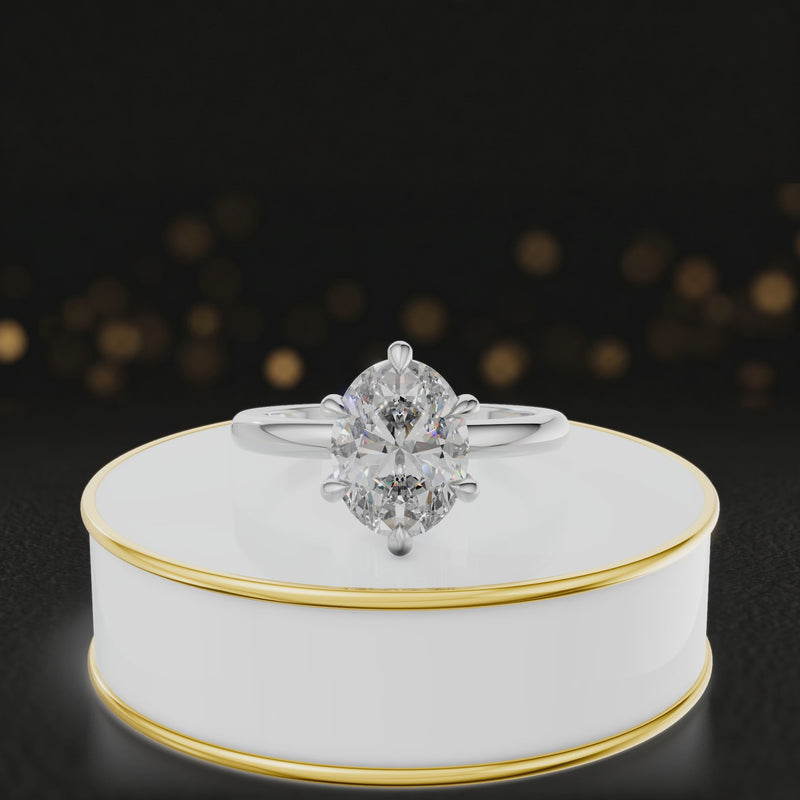 360-degree rotating view of a 1.5 carat oval cut diamond solitaire engagement ring in an 18kt white gold 6 claw setting by TJ Diamond